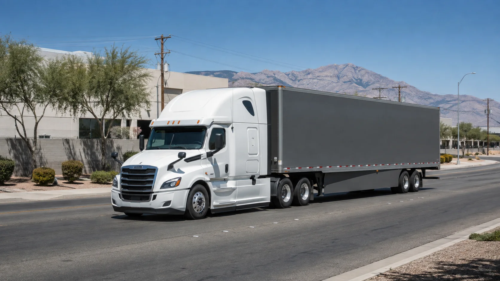 Unbranded tractor-trailer traveling on a broad Las Vegas industrial road